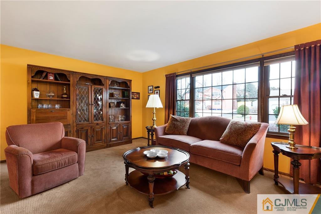 23 Roxy Avenue Edison, NJ 08820 - Photo 1 of 24 a living room with furniture and a large window