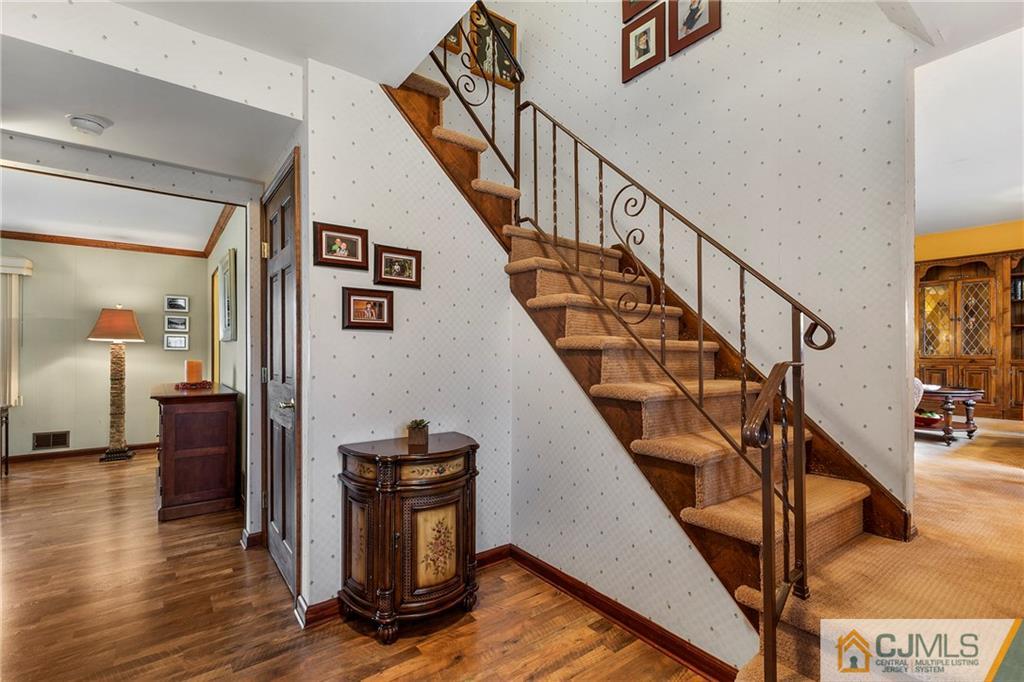 23 Roxy Avenue Edison, NJ 08820 - Photo 11 of 24 a view of entryway and hall with wooden floor