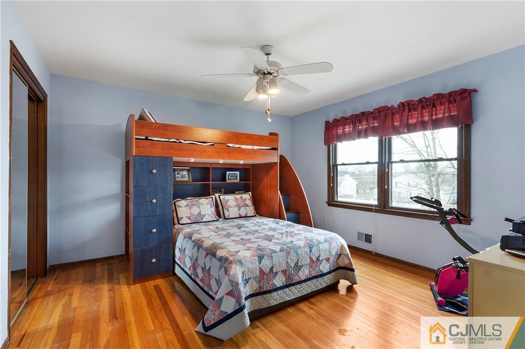 23 Roxy Avenue Edison, NJ 08820 - Photo 15 of 24 a bedroom with a bed and a window