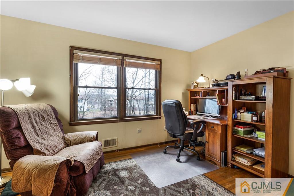 23 Roxy Avenue Edison, NJ 08820 - Photo 16 of 24 a living room with furniture a rug and a window