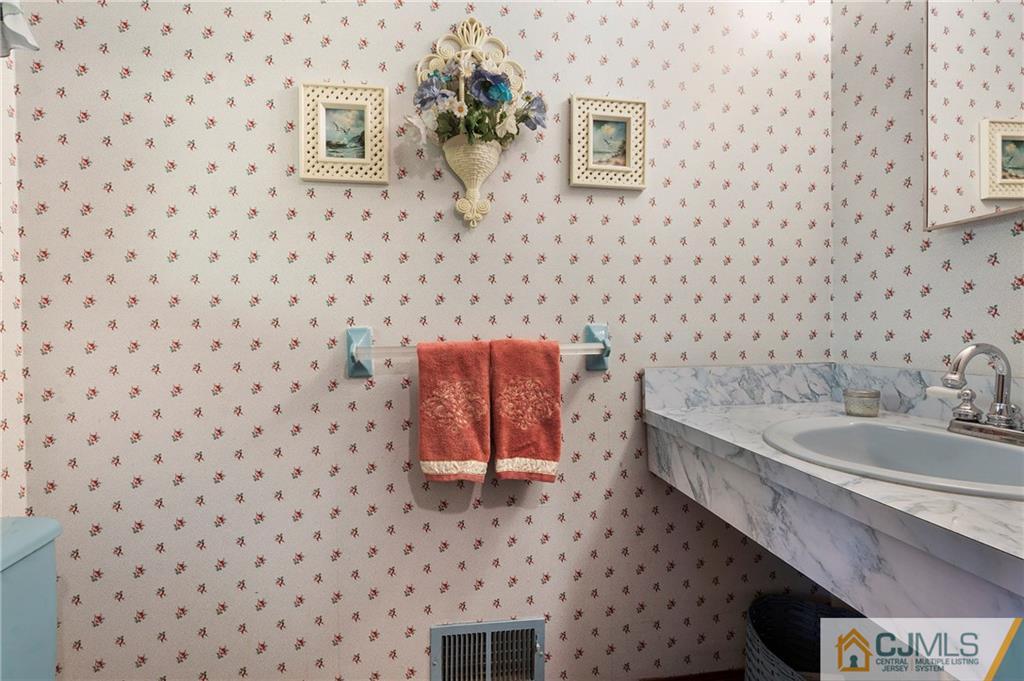 23 Roxy Avenue Edison, NJ 08820 - Photo 17 of 24 a bathroom with a sink and a bathtub