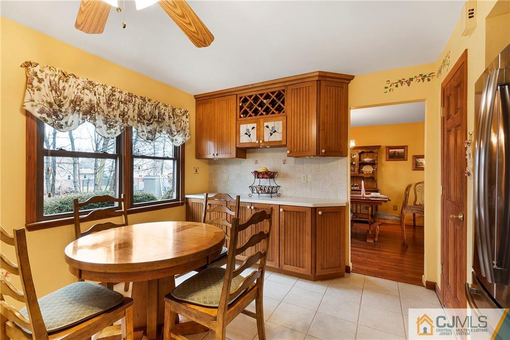 23 Roxy Avenue Edison, NJ 08820 - Photo 6 of 24 a dining room with a table and chairs