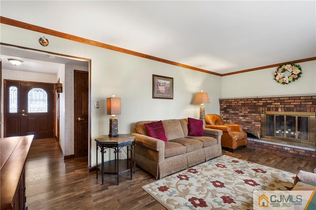 23 Roxy Avenue Edison, NJ 08820 - Photo 10 of 24 a living room with furniture and a fireplace