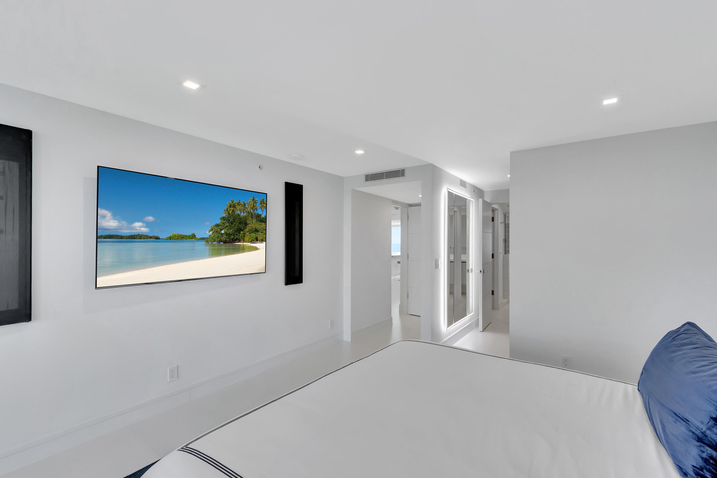 250 South Ocean Boulevard, Unit 16G Boca Raton, FL 33432 - Photo 42 of 91 a bedroom with a bed and a painting on the wall
