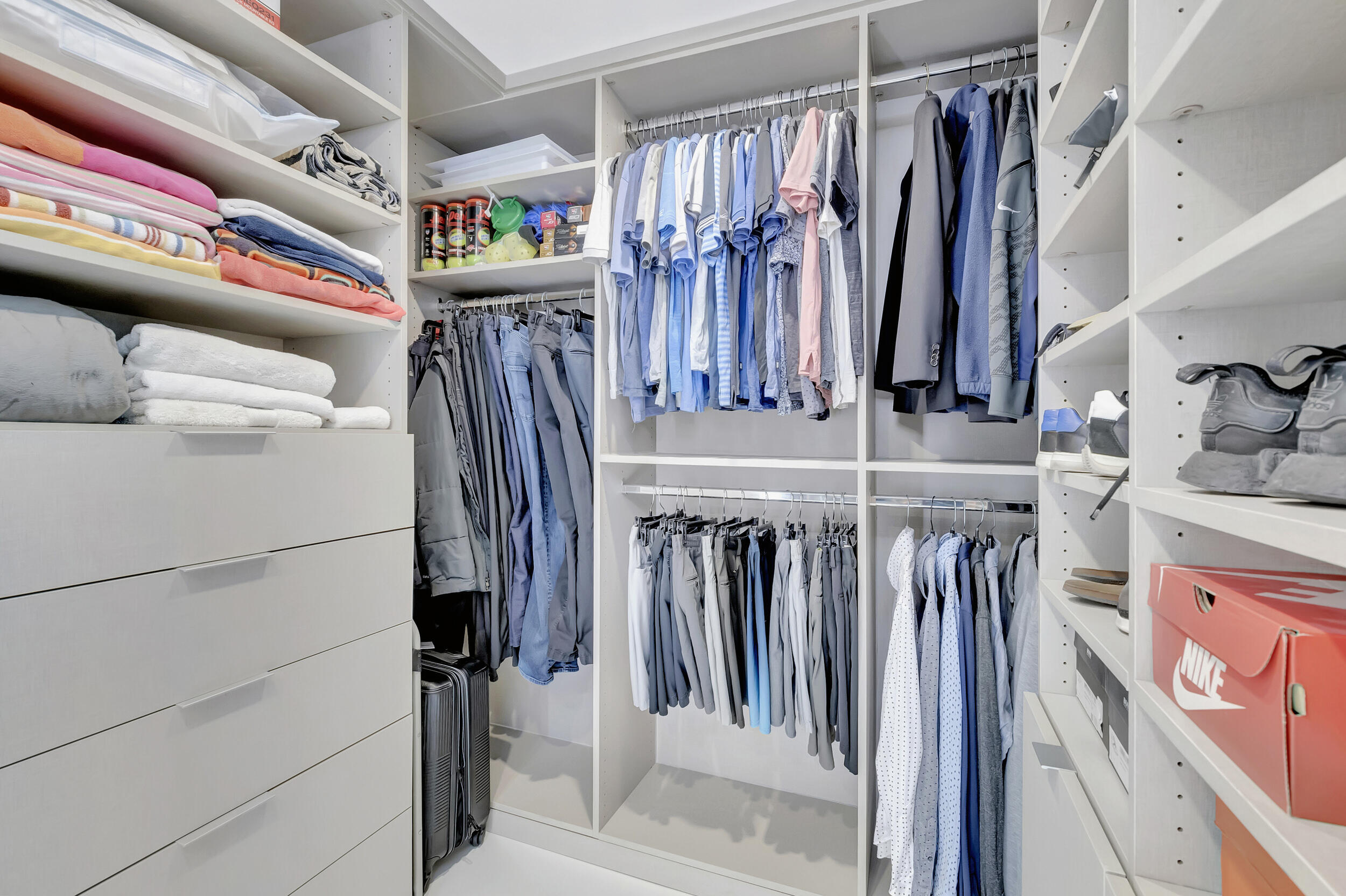 250 South Ocean Boulevard, Unit 16G Boca Raton, FL 33432 - Photo 47 of 91 a view of walk in closet with clothes and shoes