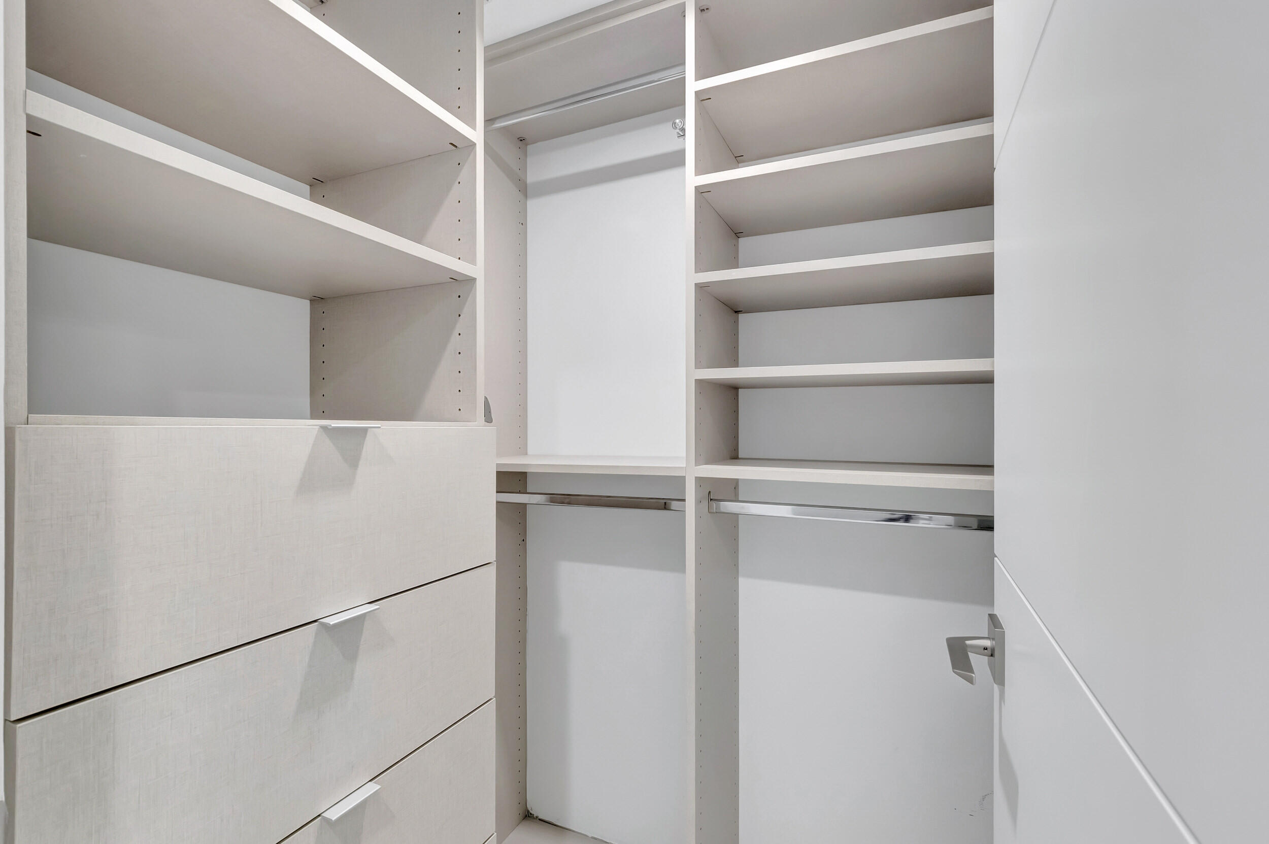250 South Ocean Boulevard, Unit 16G Boca Raton, FL 33432 - Photo 48 of 91 a view of walk in closet with empty racks