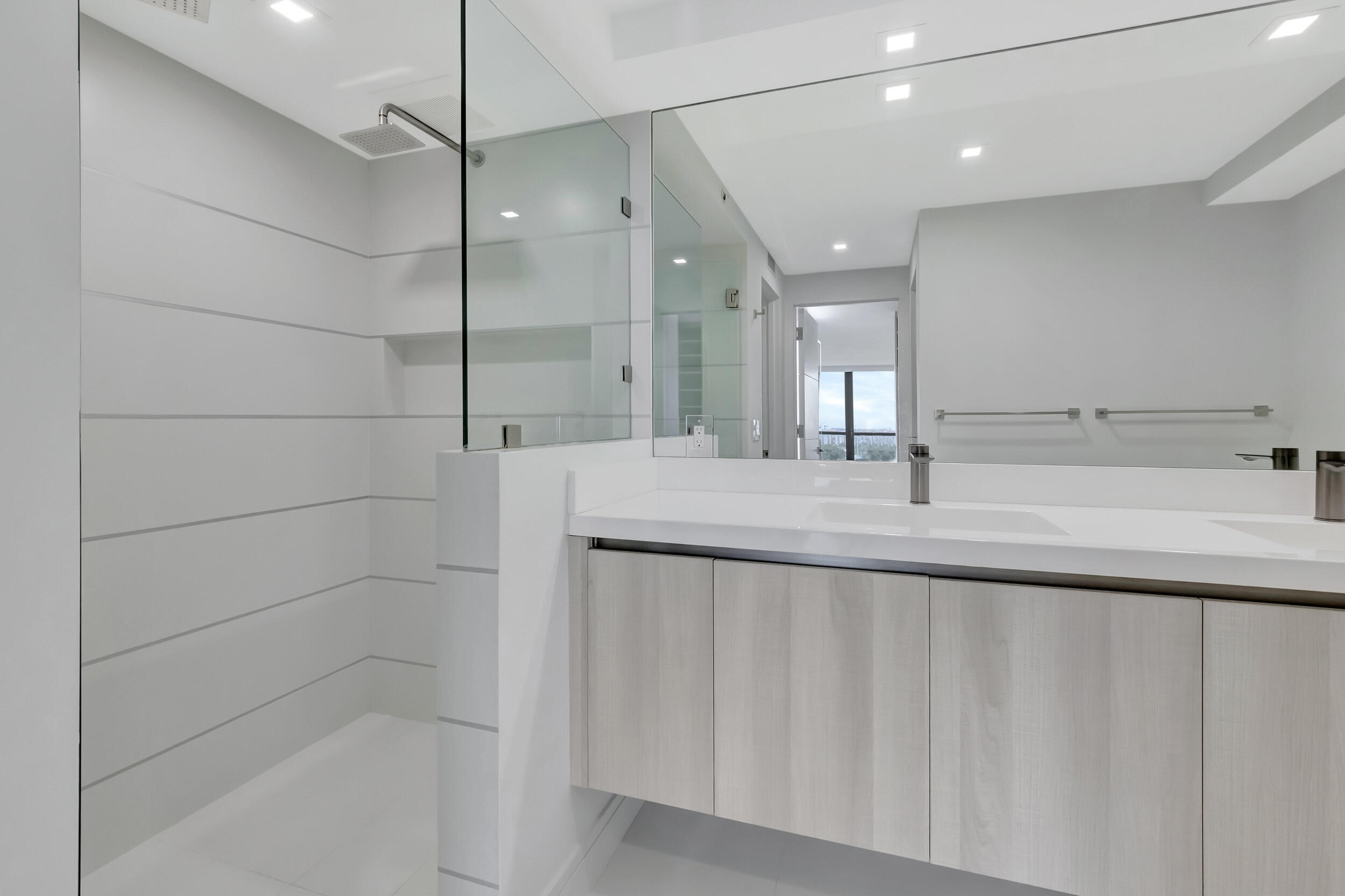 250 South Ocean Boulevard, Unit 16G Boca Raton, FL 33432 - Photo 51 of 91 a bathroom with a shower and a sink