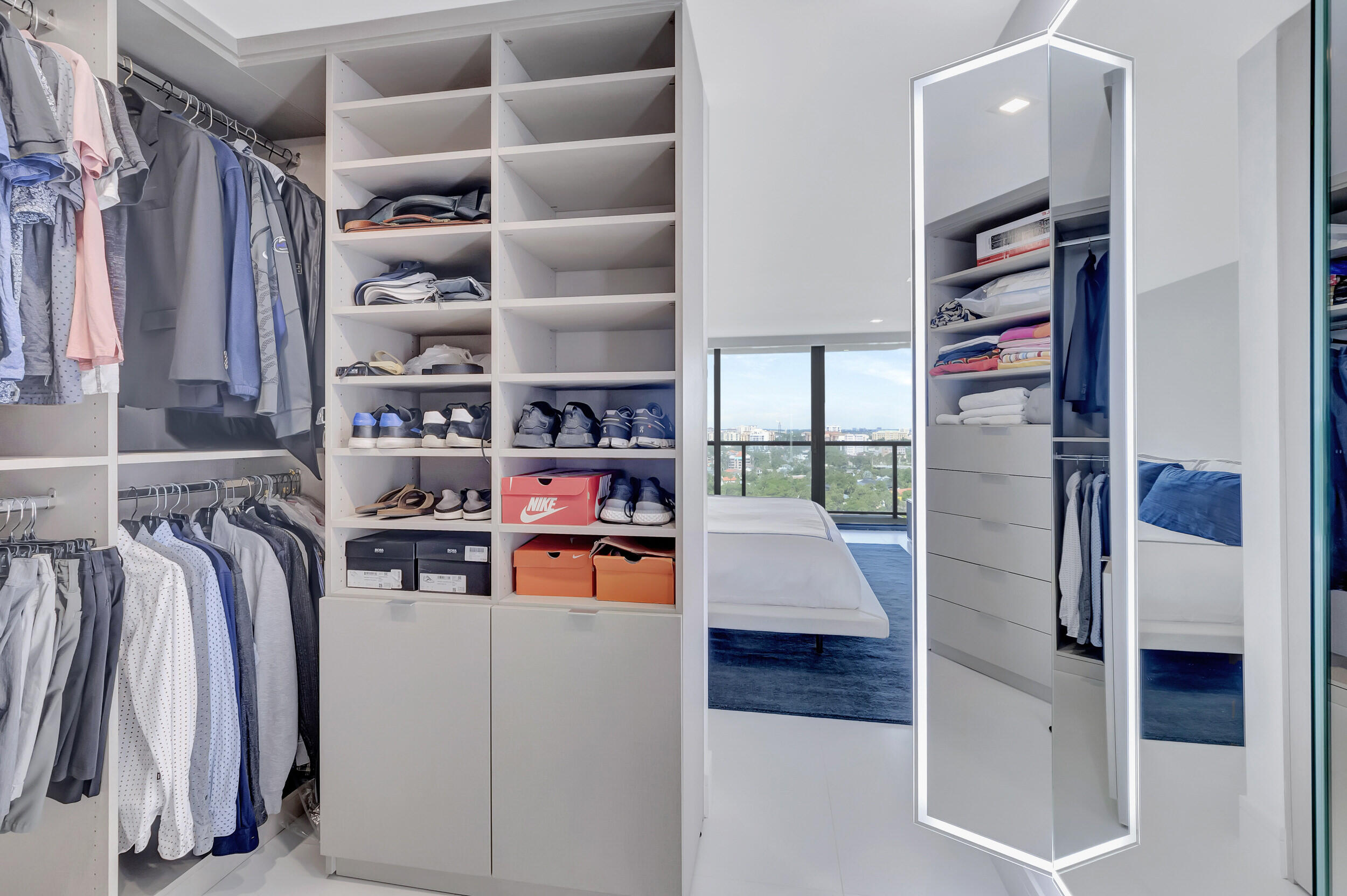 250 South Ocean Boulevard, Unit 16G Boca Raton, FL 33432 - Photo 53 of 91 a view of walk in closet with clothes and shoes
