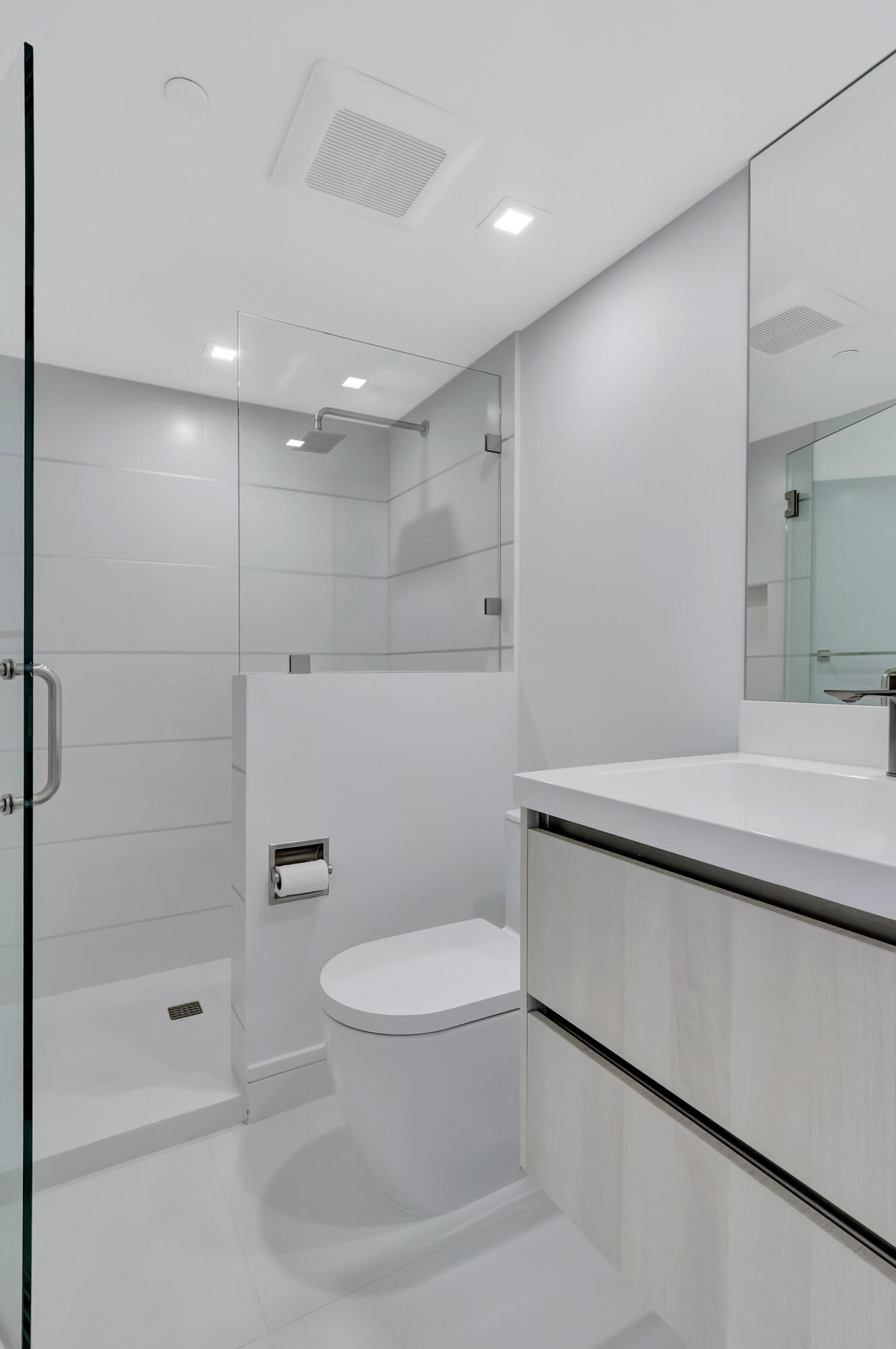 250 South Ocean Boulevard, Unit 16G Boca Raton, FL 33432 - Photo 55 of 91 a bathroom with a toilet a sink and shower
