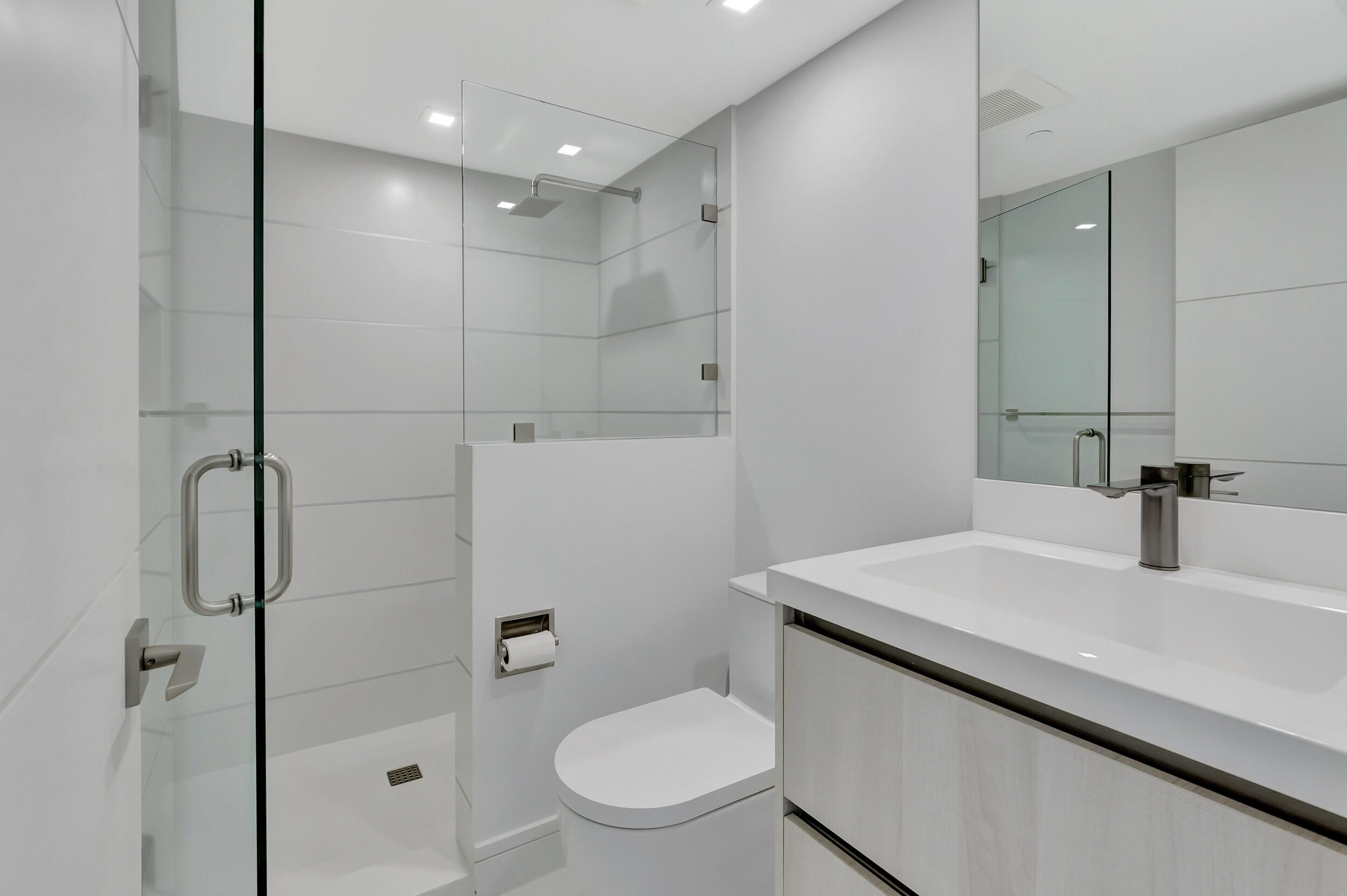 250 South Ocean Boulevard, Unit 16G Boca Raton, FL 33432 - Photo 56 of 91 a bathroom with a sink a toilet and shower