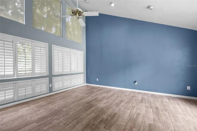 a view of an empty room with a window