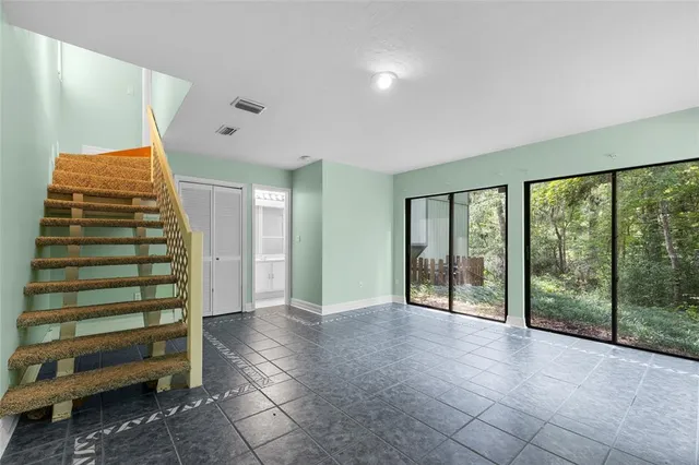 a view of an empty room with a balcony