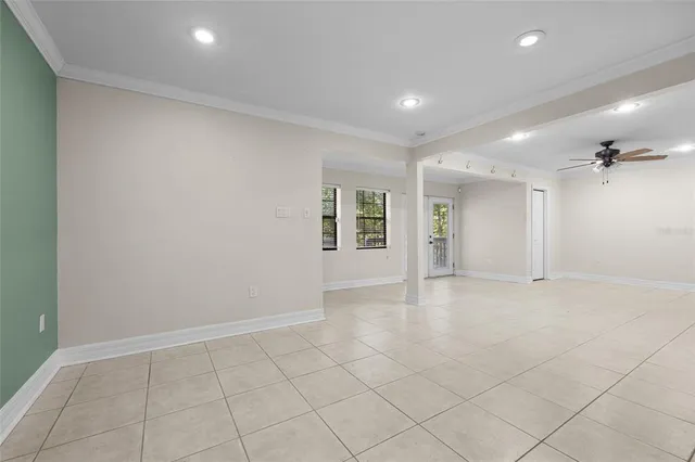 an empty room with windows and pillars in it