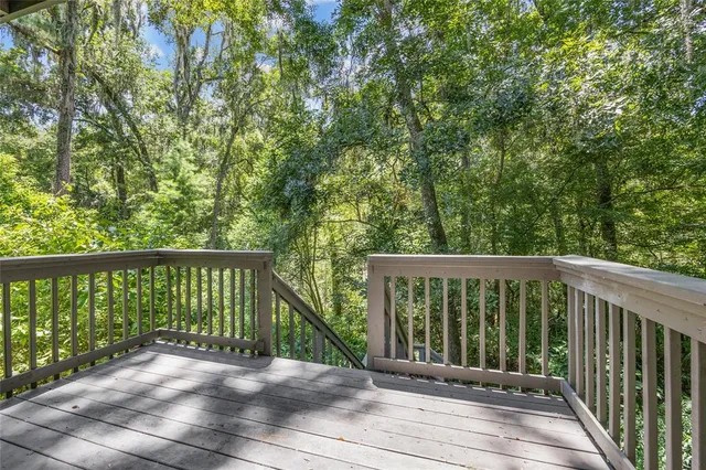 a balcony with trees in front of it