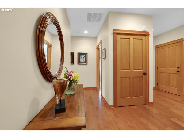 a view of a livingroom with furniture and a mirror