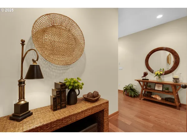 a living room with furniture and a mirror