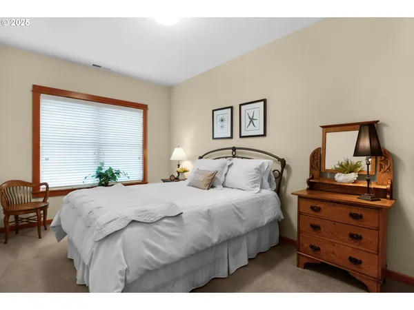 a bedroom with a bed and with furniture