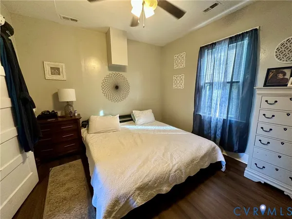 a bedroom with a bed and a dresser