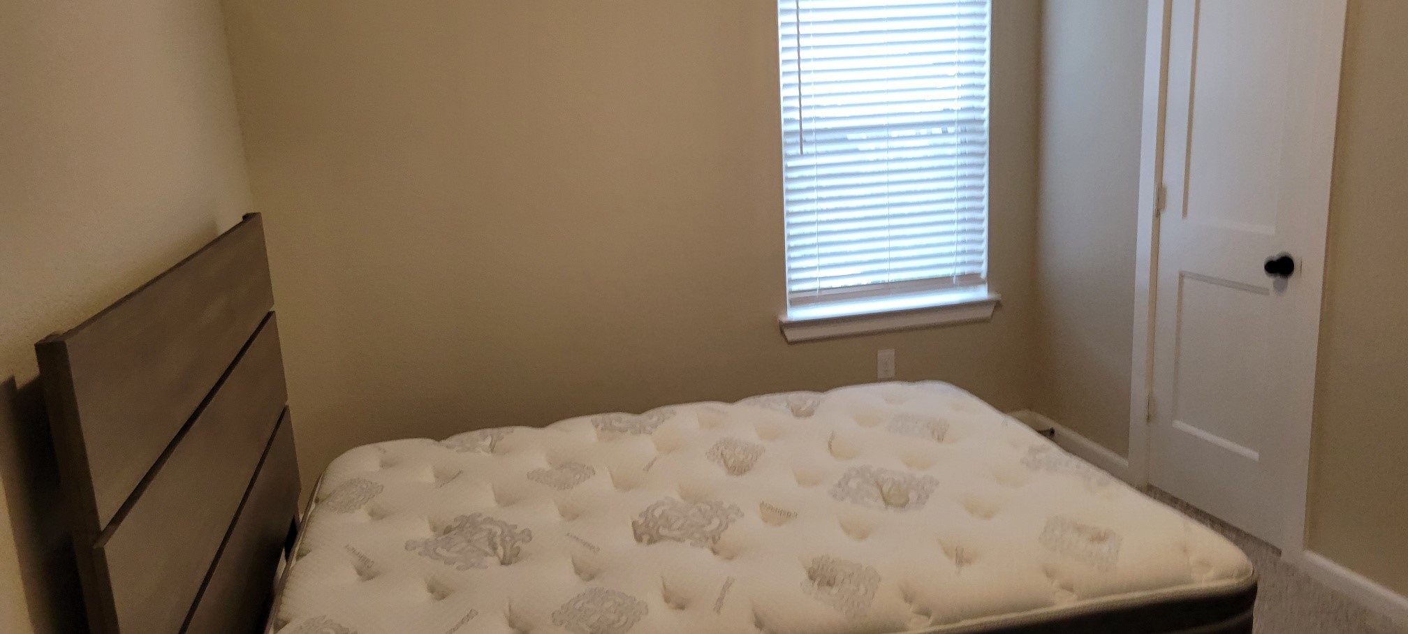 405 Rise Lane Montgomery, TX 77316 - Photo 13 of 17 a close up of a bed in a small room