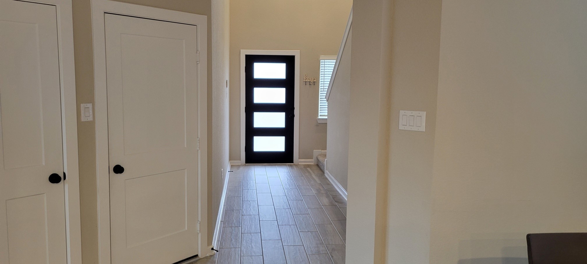 405 Rise Lane Montgomery, TX 77316 - Photo 8 of 17 a view of a hallway with wooden floor and closet area
