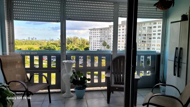 a view of a balcony with chairs