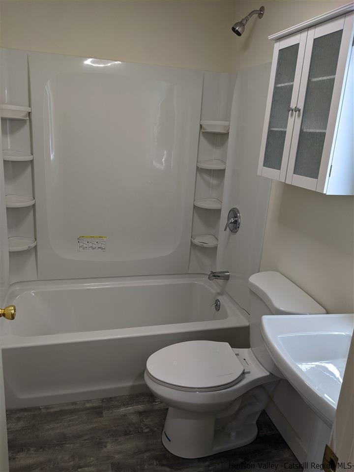 78-88 Spring Street Kingston, NY 12401 - Photo 14 of 34 a bathroom with a toilet and a shower
