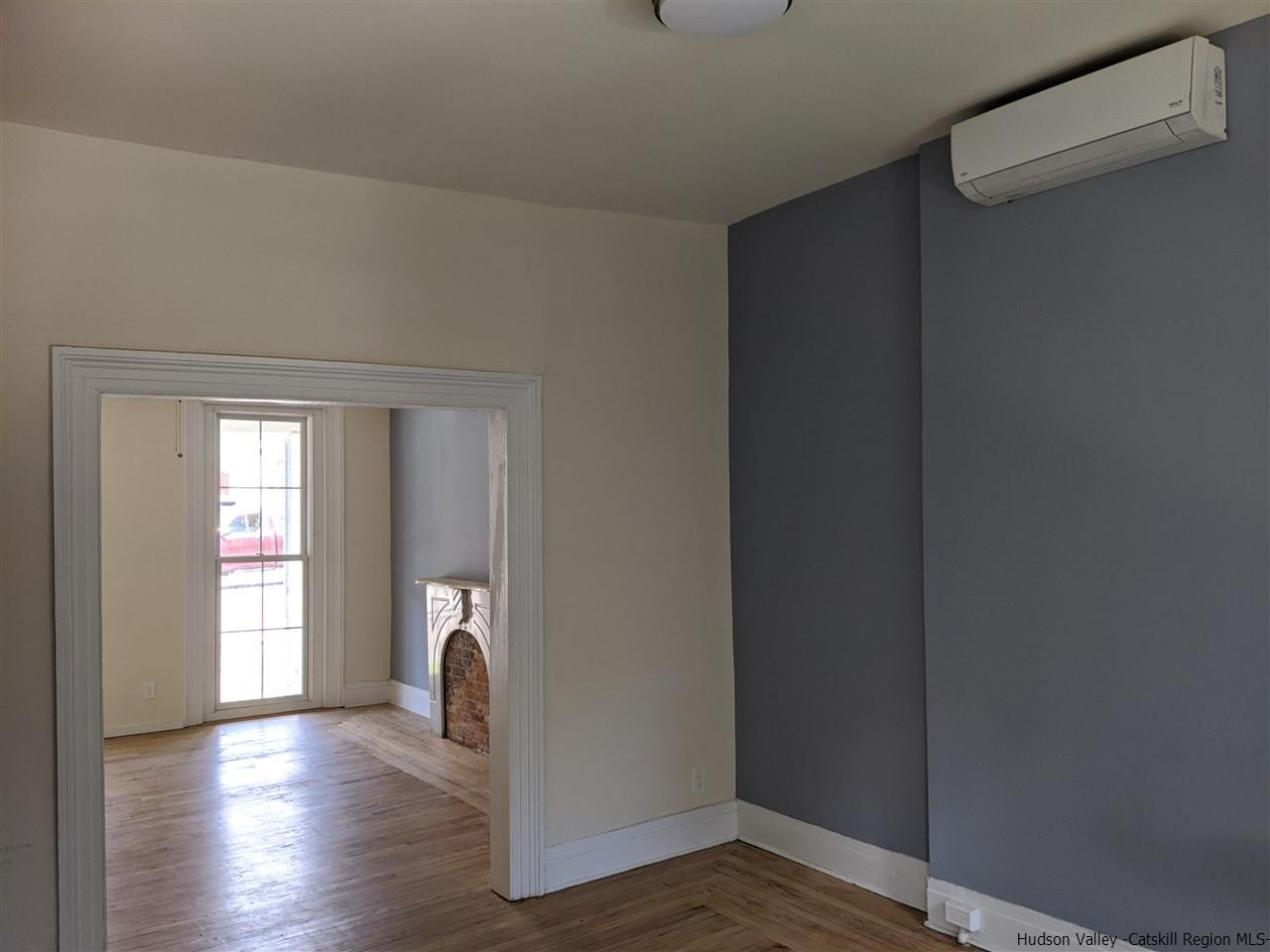 78-88 Spring Street Kingston, NY 12401 - Photo 23 of 34 a view of empty room with window and wooden floor