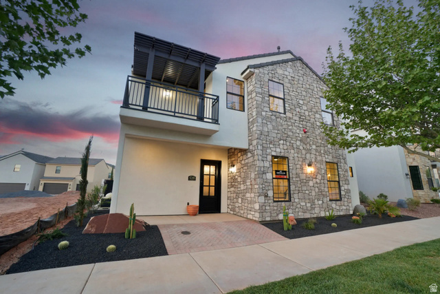 4346 Canterbury Road Hurricane, UT 84737 - Photo 1 of 37 View of front facade featuring stone siding, stucco siding, and a balcony