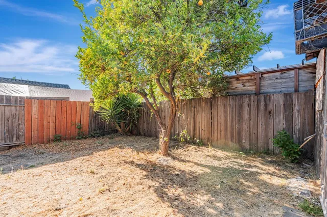 a view of wooden fence of a house