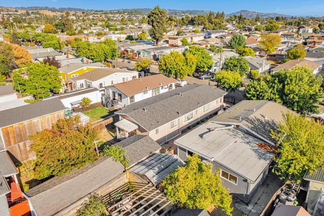 an aerial view of residential houses with outdoor space