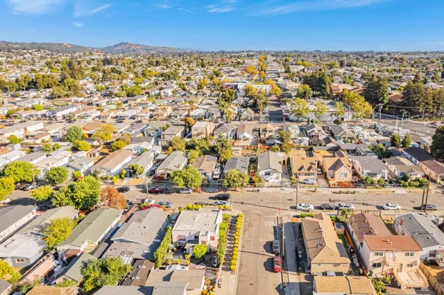 an aerial view of residential building and parking space