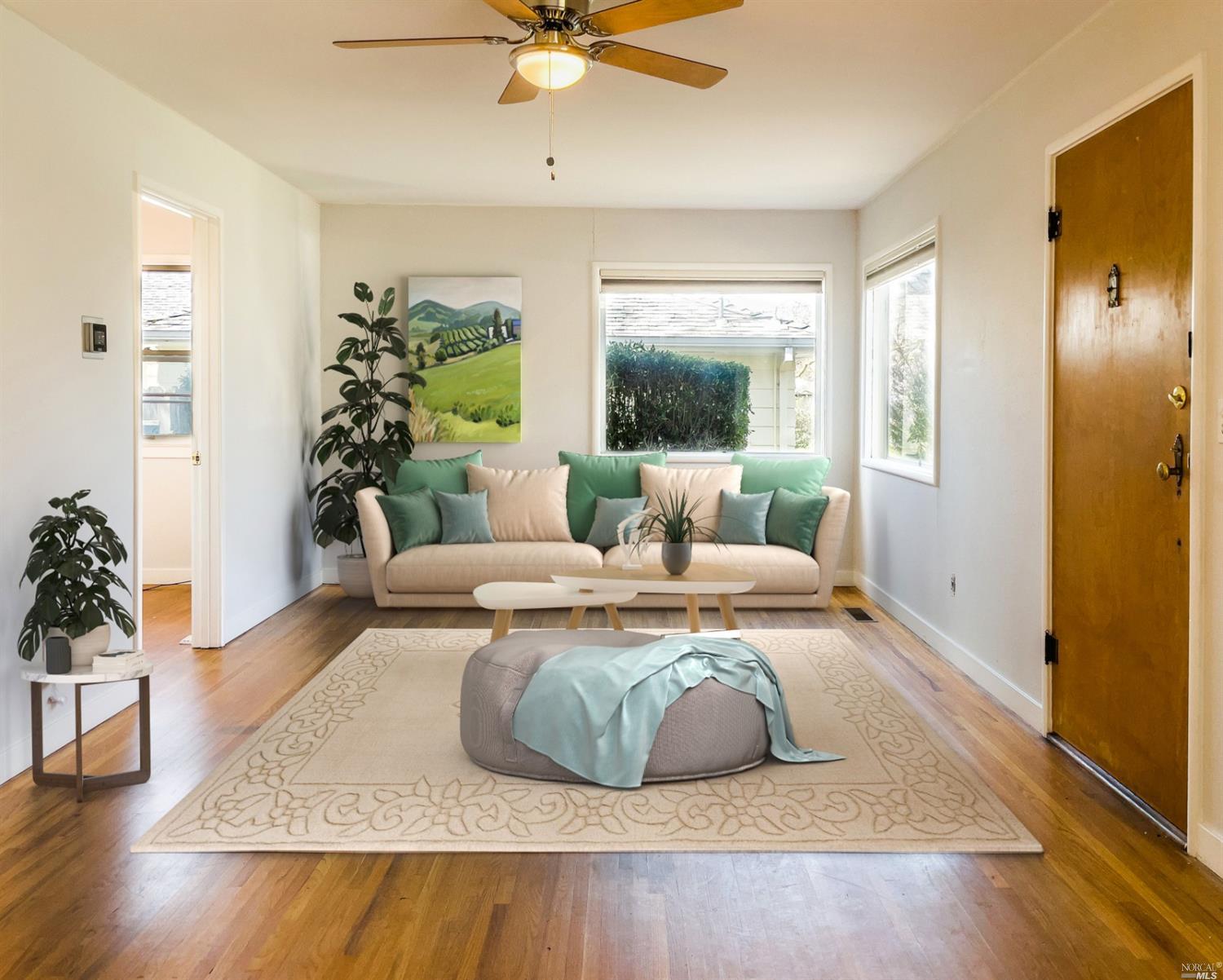 1056 Bush Street Santa Rosa, CA 95404 - Photo 1 of 1 Open living and family room with beautiful wood floors and natural light.