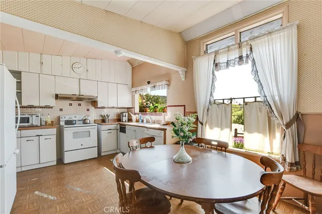 a view of a hallway with entryway door front door
