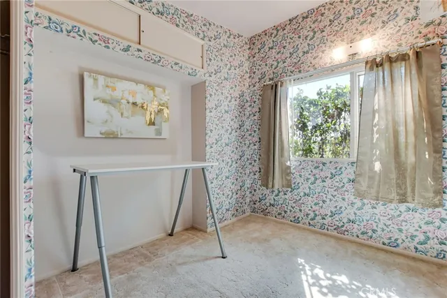 a view of an empty room and window