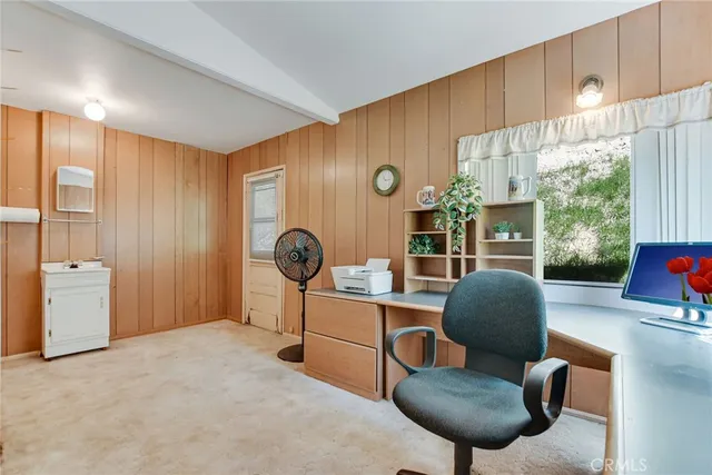 a view of a hallway with entryway door front door