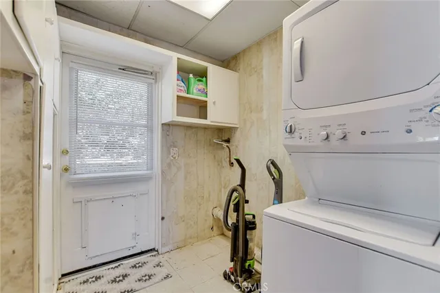 a bathroom with a granite countertop sink a bathtub and a shower