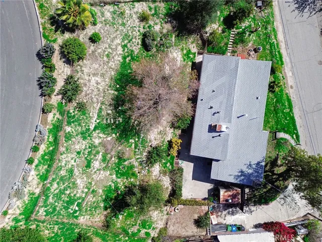 an aerial view of multiple houses with outdoor space
