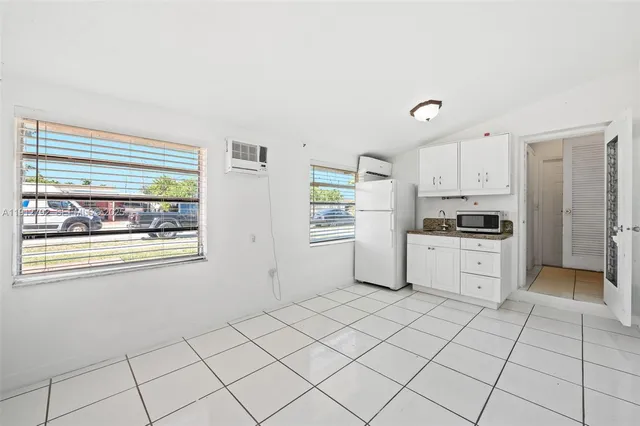 a kitchen with granite countertop cabinets and steel stainless steel appliances