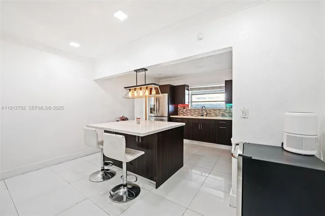 a kitchen with a sink cabinets and window