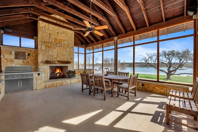 a dining room with furniture water view and balcony