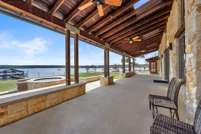 aerial view of a house with a garden and lake view