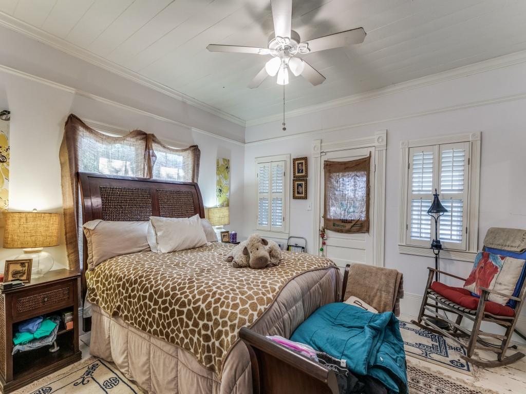 392 Mt Pleasant Road Valley View, TX 76272 - Photo 11 of 27 a bedroom with a bed a couch and dresser