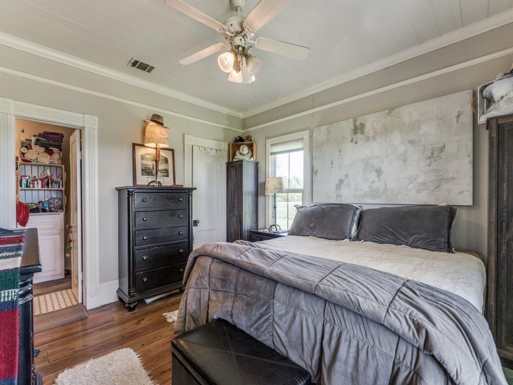 392 Mt Pleasant Road Valley View, TX 76272 - Photo 14 of 27 a bedroom with a bed dresser and a window