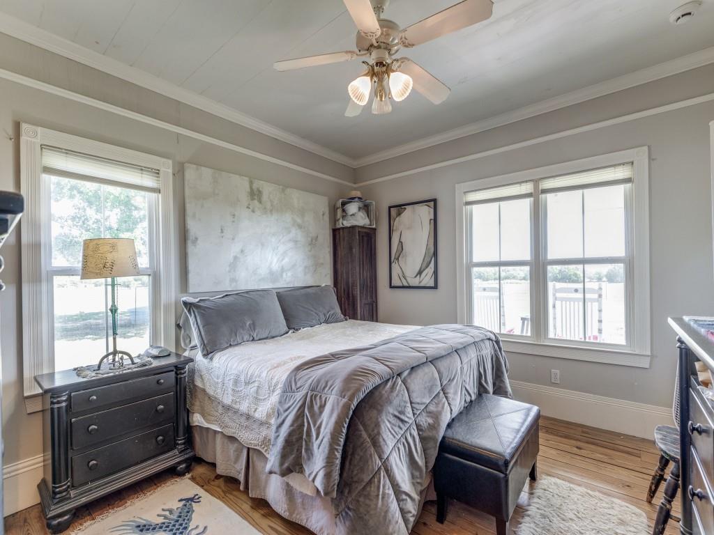392 Mt Pleasant Road Valley View, TX 76272 - Photo 15 of 27 a bedroom with a bed dresser and a window