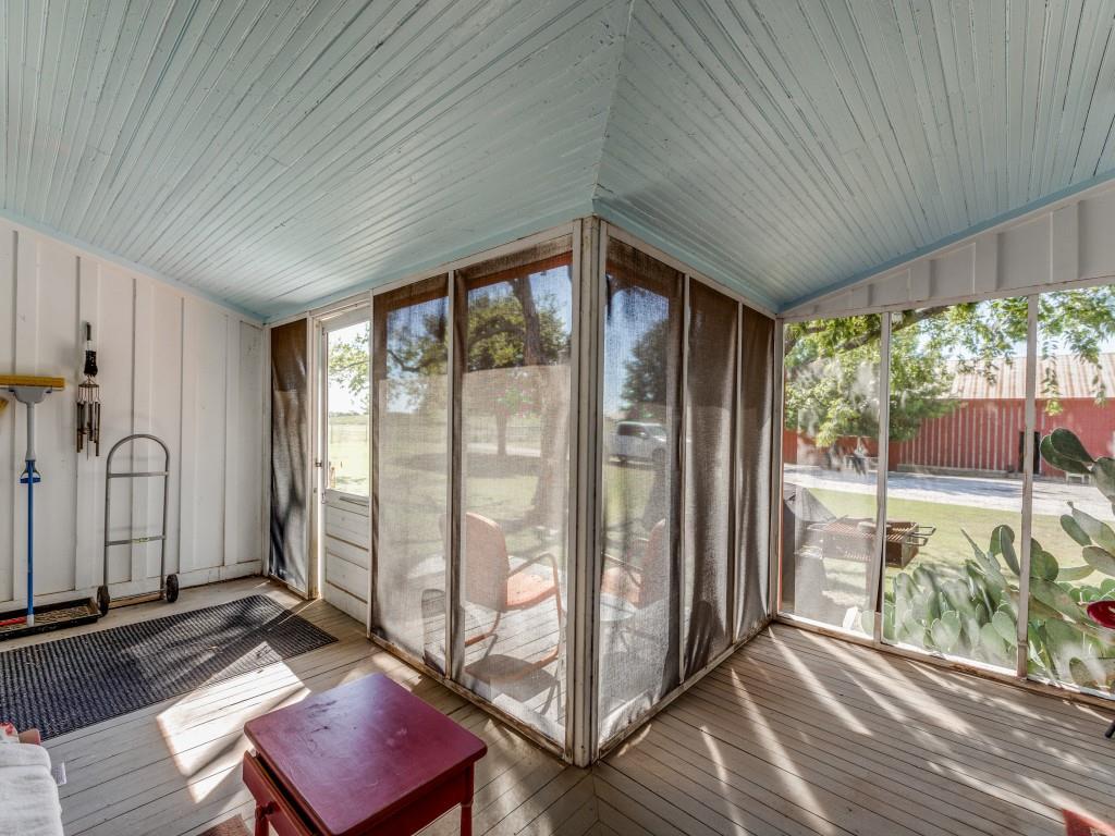 392 Mt Pleasant Road Valley View, TX 76272 - Photo 23 of 27 a living room with large windows