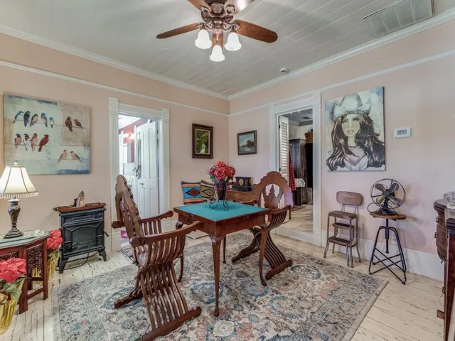 a work room with furniture and wooden floor