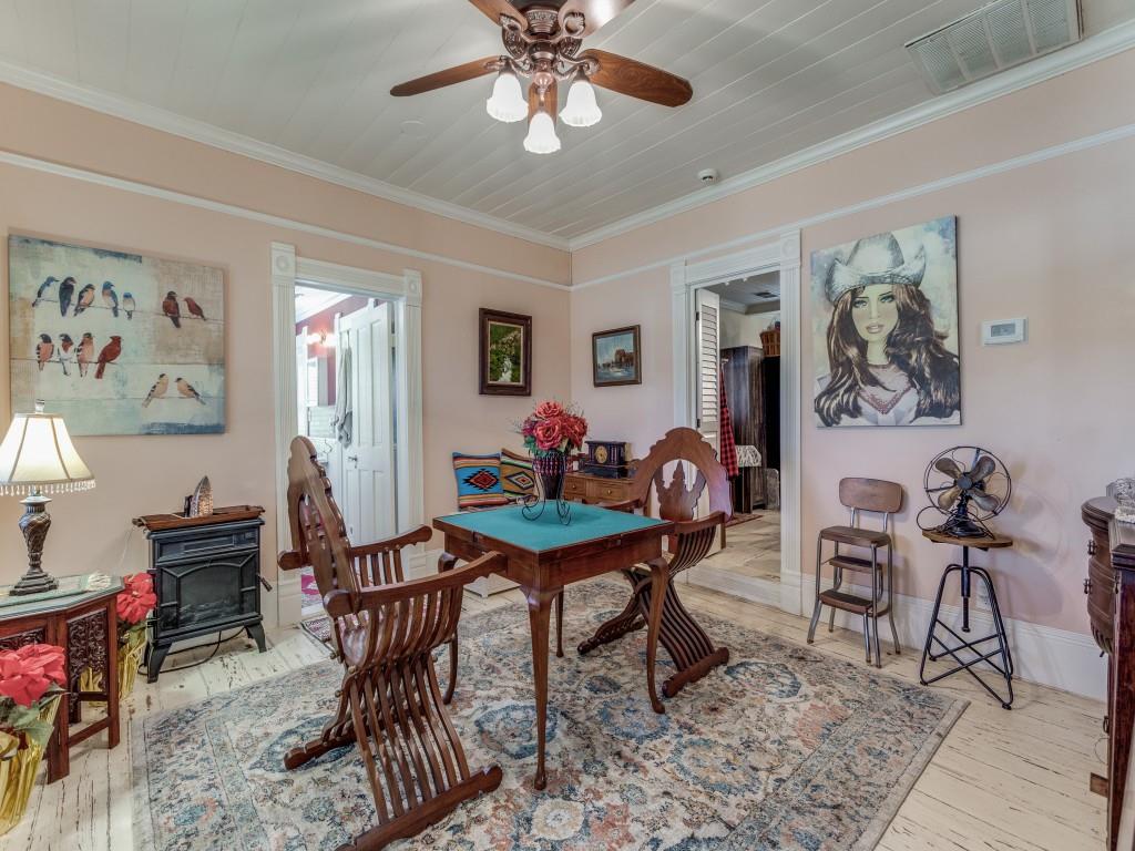 392 Mt Pleasant Road Valley View, TX 76272 - Photo 5 of 27 a work room with furniture and wooden floor