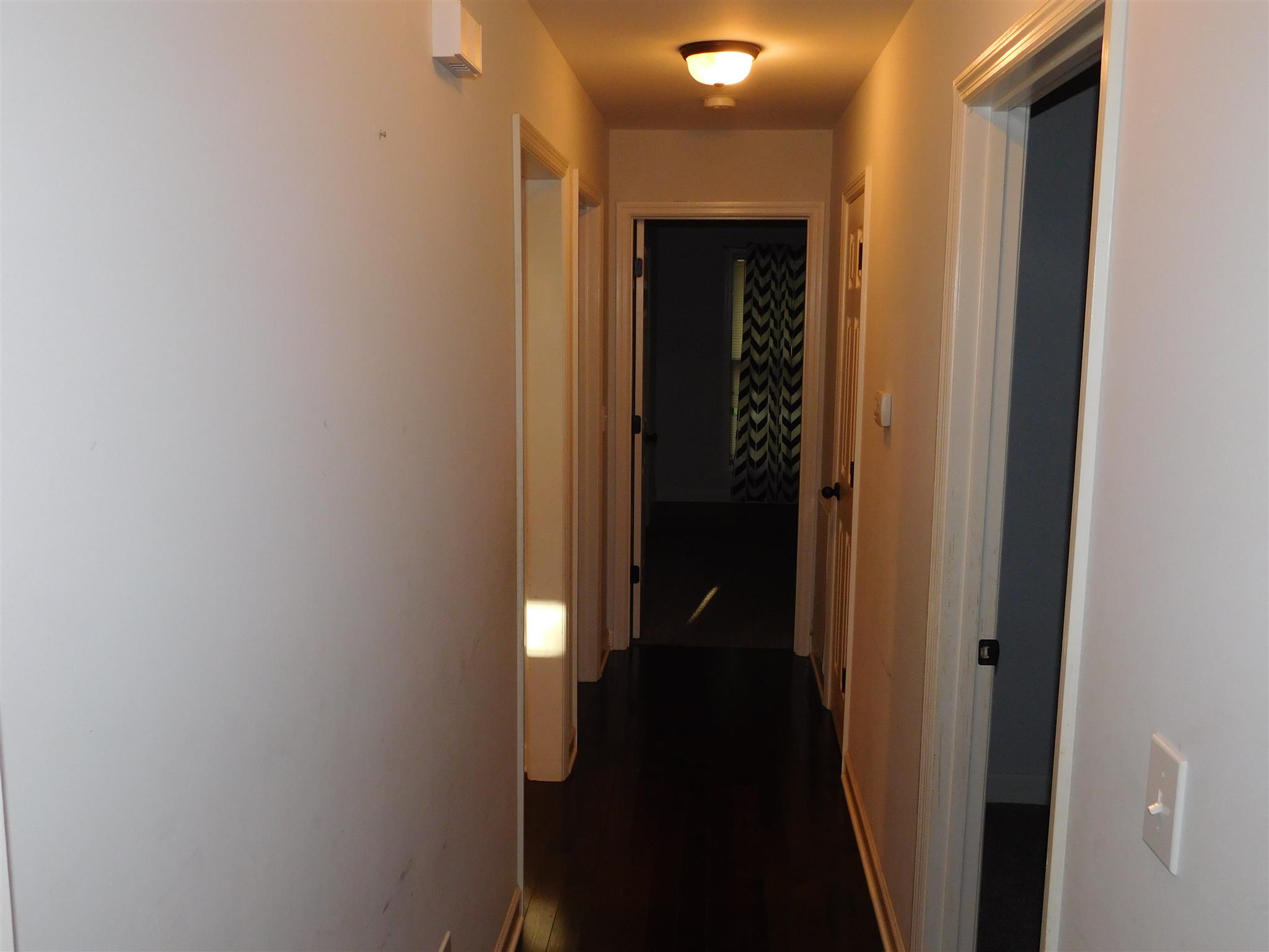 1705 Shaffer Road Manchester, TN 37355 - Photo 8 of 21 a view of a hallway with a wooden floor