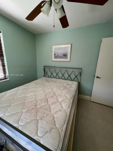 413 Southwest 2nd Avenue Dania Beach, FL 33004 - Photo 2 of 8 a bedroom with a bed and painting on the wall