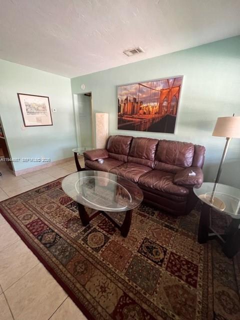 413 Southwest 2nd Avenue Dania Beach, FL 33004 - Photo 7 of 8 a living room with furniture and a rug